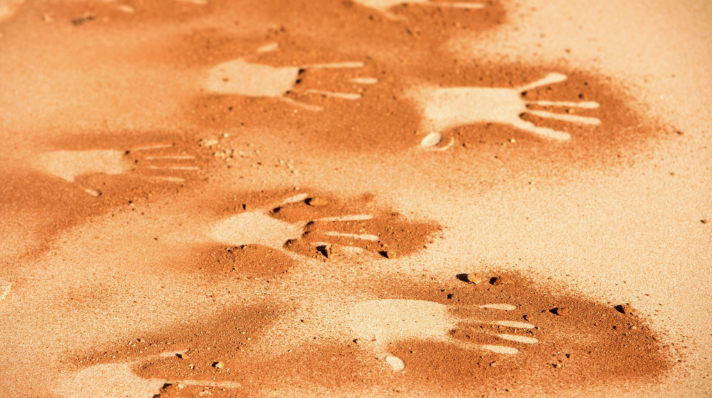 Aboriginal handprints in the sand, aboriginal acknowledgements